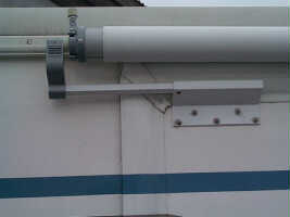Slide topper installed in bracket. Slide topper installed in bracket.