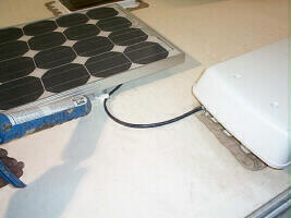 Applying sealant to the solar panel mounts ...