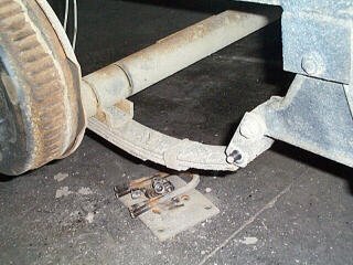 Removing hardware and disconnecting brake lines