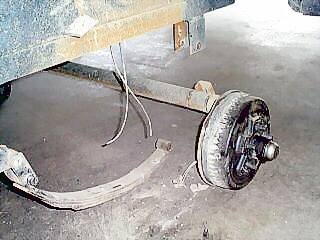 Front axle assembly dropped to the workshop floor