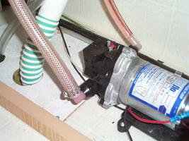 The winterizing hose hooked up to the water pump inlet side ...